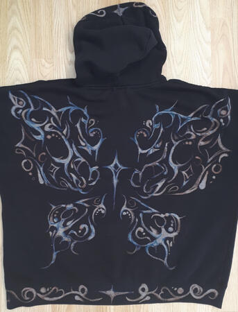 "𝗕𝗹𝗲𝗮𝗰𝗵𝗲𝗱" Handmade pattern on hoodie with bleach, inspired by cyber sigil designs.Meant to showcase a butterfly replicated by star. A thing I tend to include in majority of my drawings